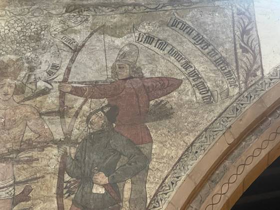 A mural of two people
Description automatically generated